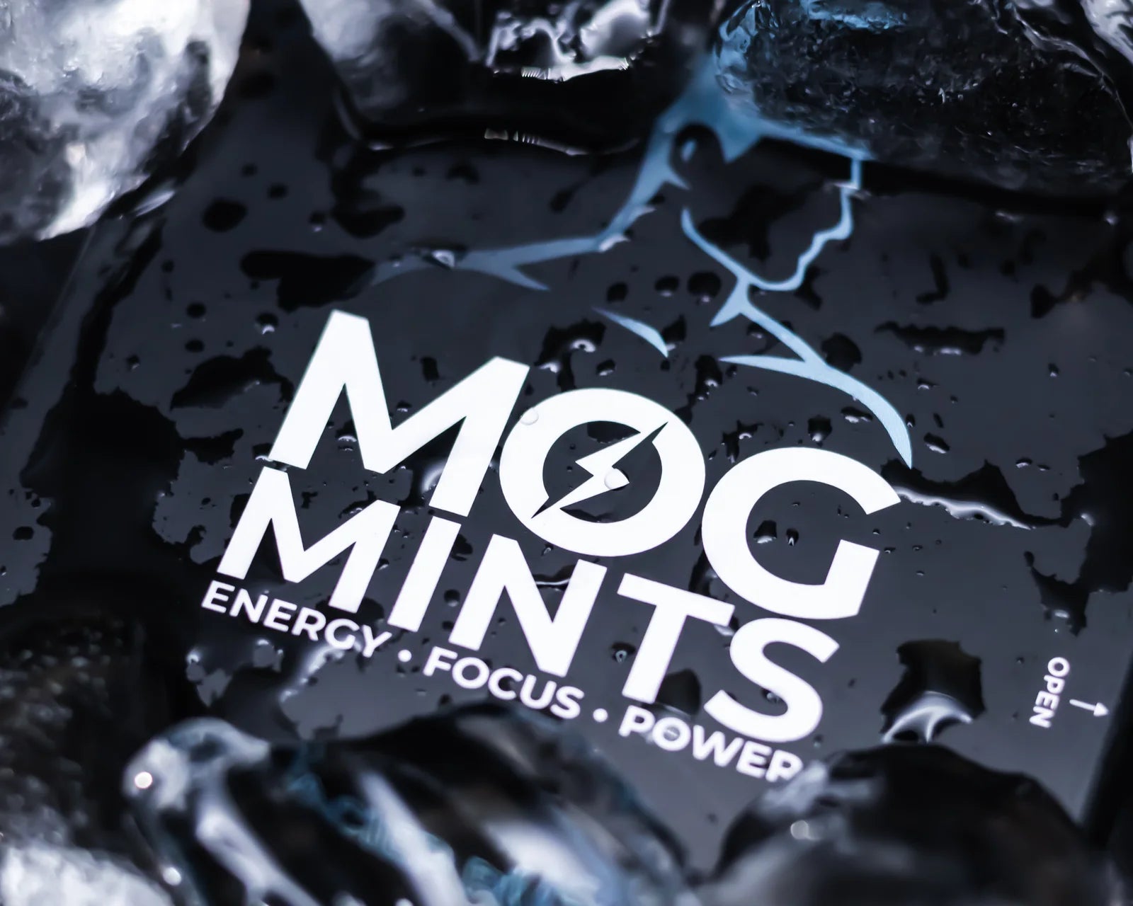 The MOG MINTS tin close up, wet, in ice.